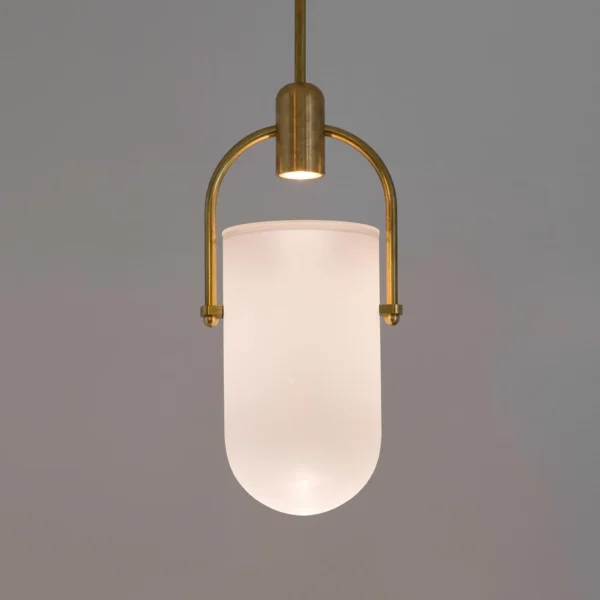 Well Arc Glass Pendant is featuring an architectural design. This modern pendant light arches down, elegantly balancing a frosted glass shade. The spot-led bulb freely rests on the arched arm and the led lighting shoots light into a sandblasted glass dome, the fixture creates a warm glow inside the glass.