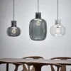 Delicate pendant lights inspired by air bubbles wrapped in a liquid.