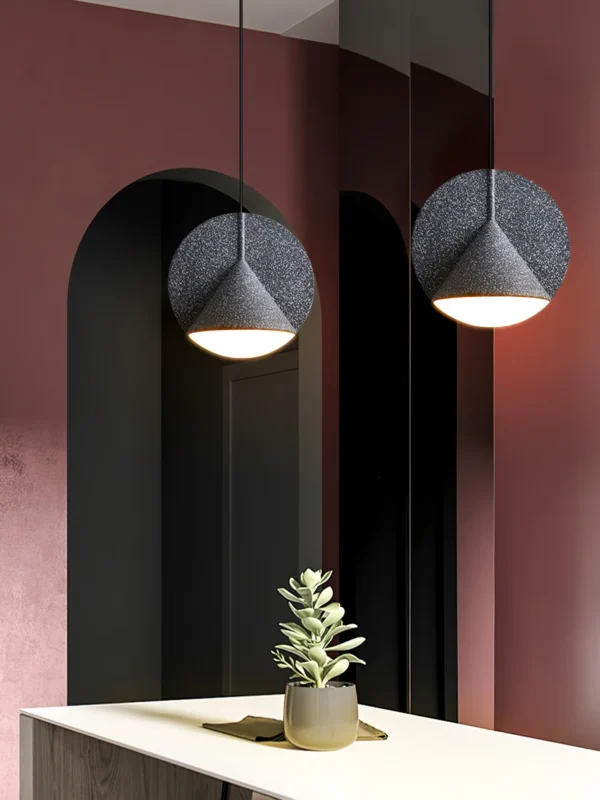 The Ossa resin pendant displays a perfect example of modern luxury. This pendant was designed to play with geometric concepts and use a mix of hard and soft materials.