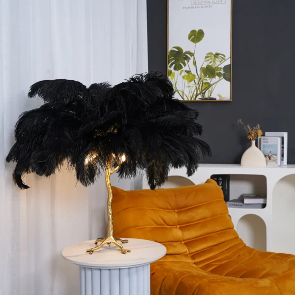 Feather your nest with the Ostrich Feather Table Lamp, romantic and feminine this sultry lamp will make a statement in your bedroom or living room. Its elegant gilded base supports real, Ostrich feathers. 