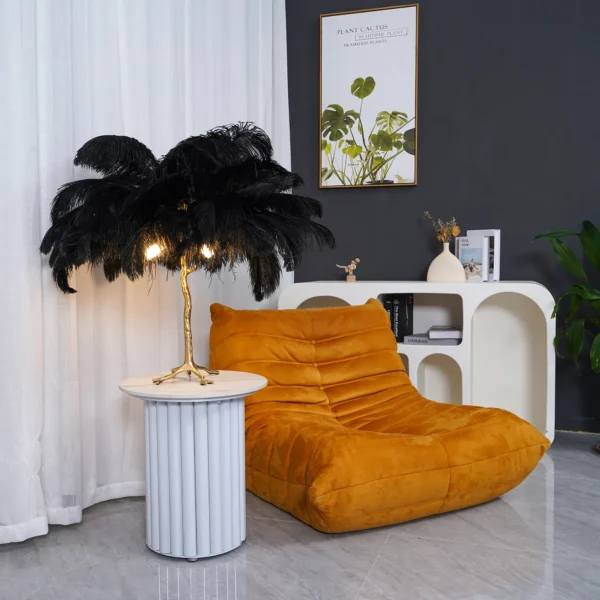 Feather your nest with the Ostrich Feather Table Lamp, romantic and feminine this sultry lamp will make a statement in your bedroom or living room. Its elegant gilded base supports real, Ostrich feathers. 
