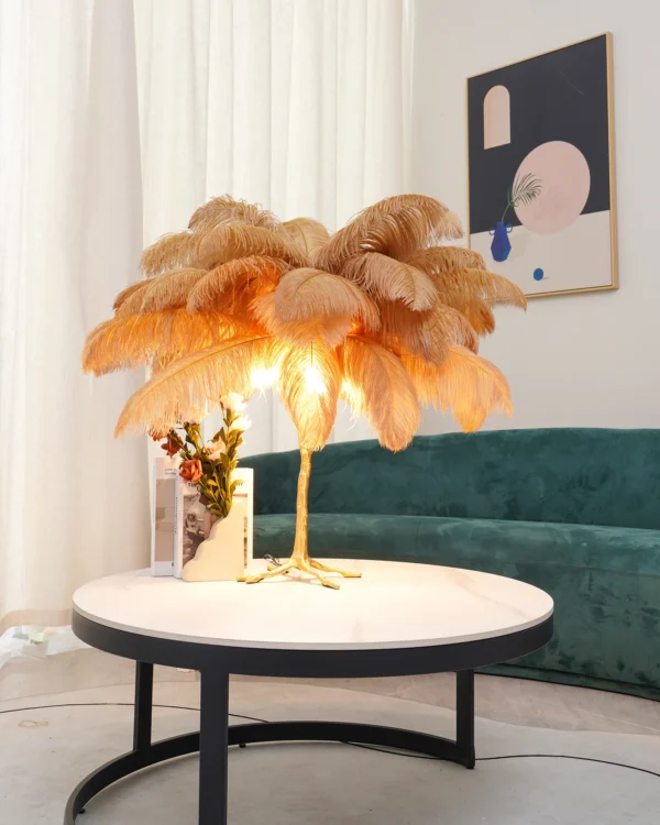 Feather your nest with the Ostrich Feather Table Lamp, romantic and feminine this sultry lamp will make a statement in your bedroom or living room. Its elegant gilded base supports real, Ostrich feathers. 