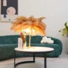 Feather your nest with the Ostrich Feather Table Lamp, romantic and feminine this sultry lamp will make a statement in your bedroom or living room. Its elegant gilded base supports real, Ostrich feathers. 