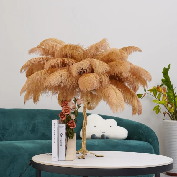 Feather your nest with the Ostrich Feather Table Lamp, romantic and feminine this sultry lamp will make a statement in your bedroom or living room. Its elegant gilded base supports real, Ostrich feathers. 