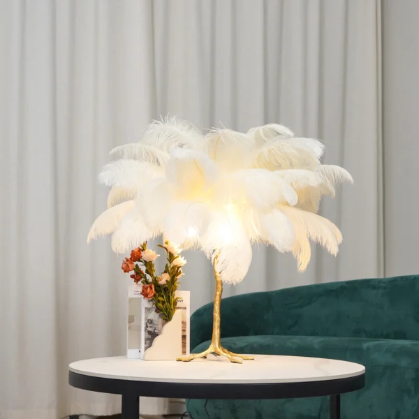 Feather your nest with the Ostrich Feather Table Lamp, romantic and feminine this sultry lamp will make a statement in your bedroom or living room. Its elegant gilded base supports real, Ostrich feathers. 