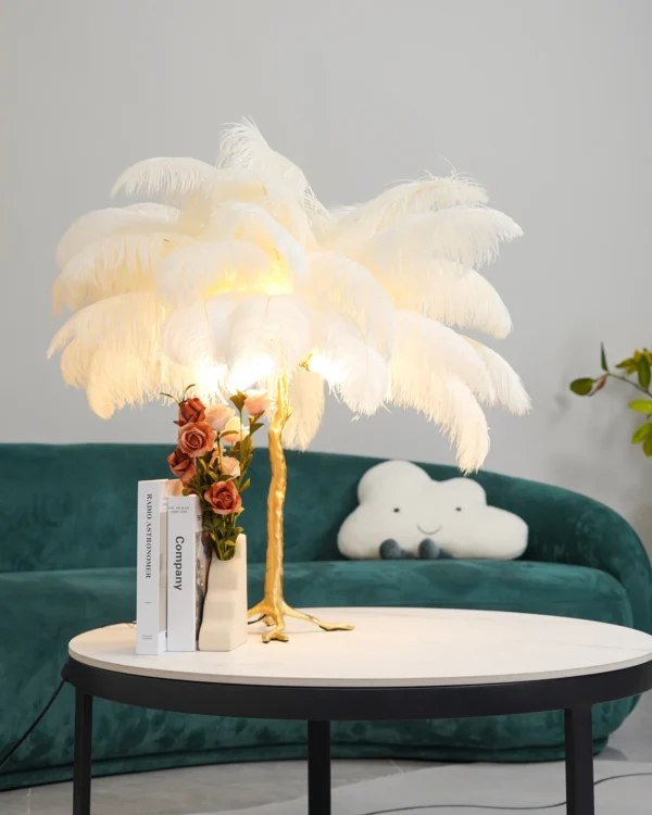 Feather your nest with the Ostrich Feather Table Lamp, romantic and feminine this sultry lamp will make a statement in your bedroom or living room. Its elegant gilded base supports real, Ostrich feathers. 