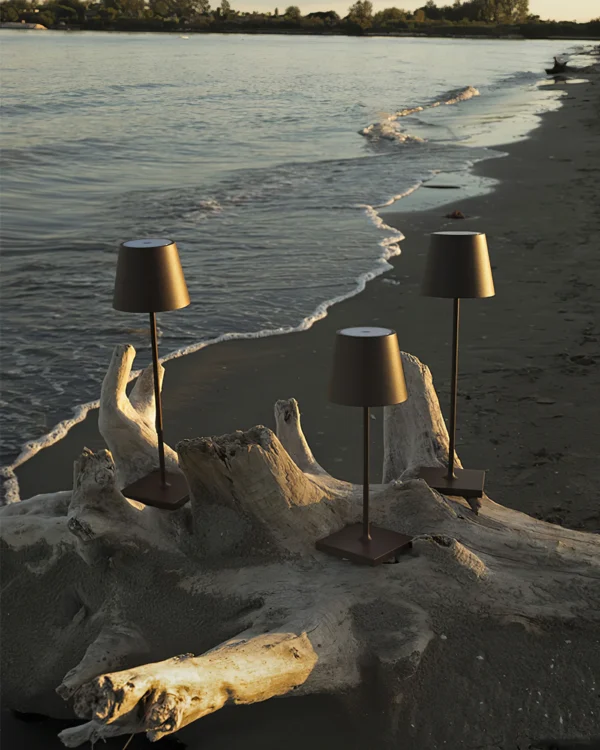 The fixture is made up of metal with LED light source, ensuring a clean display along with a tasteful layer of light. This piece lights the way wherever it is placed, providing a full and inviting glow. Its square base ensures a sturdy display. Purchase Notes: Only supports shipping to Japan, Australia, the EU, and the United States, other countries do not support shipping. If you have any questions about our products, please contact us and we will get back to you within 24 hours. Product Size Size: ∅ 4.3″ x H 15″ / Dia 11cm x H 38cm Details Material: Metal, Acrylic, Aluminum alloy Light source: Integrated LED Voltage: AC 110-240V Battery capacity (mAh): 2000 mAh Charging voltage: 5V---2A or 8V---2A Charging time: ~3 hours to fully charge Continuous discharge time: the maximum power can be used for about 3 hours, and the minimum power can be used continuously for about 10 hours. Color: White, Black, Gold, Pink, Silver Control method: Touch switch (Dimmable) We provide with USB charging cable. Approved: ETL, UL listed and CE, SAA certification.