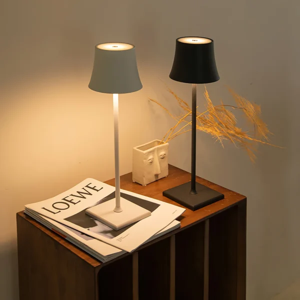 The fixture is made up of metal with LED light source, ensuring a clean display along with a tasteful layer of light. This piece lights the way wherever it is placed, providing a full and inviting glow. Its square base ensures a sturdy display. Purchase Notes: Only supports shipping to Japan, Australia, the EU, and the United States, other countries do not support shipping. If you have any questions about our products, please contact us and we will get back to you within 24 hours. Product Size Size: ∅ 4.3″ x H 15″ / Dia 11cm x H 38cm Details Material: Metal, Acrylic, Aluminum alloy Light source: Integrated LED Voltage: AC 110-240V Battery capacity (mAh): 2000 mAh Charging voltage: 5V---2A or 8V---2A Charging time: ~3 hours to fully charge Continuous discharge time: the maximum power can be used for about 3 hours, and the minimum power can be used continuously for about 10 hours. Color: White, Black, Gold, Pink, Silver Control method: Touch switch (Dimmable) We provide with USB charging cable. Approved: ETL, UL listed and CE, SAA certification.