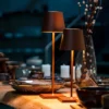 The fixture is made up of metal with LED light source, ensuring a clean display along with a tasteful layer of light. This piece lights the way wherever it is placed, providing a full and inviting glow. Its square base ensures a sturdy display. Purchase Notes: Only supports shipping to Japan, Australia, the EU, and the United States, other countries do not support shipping. If you have any questions about our products, please contact us and we will get back to you within 24 hours. Product Size Size: ∅ 4.3″ x H 15″ / Dia 11cm x H 38cm Details Material: Metal, Acrylic, Aluminum alloy Light source: Integrated LED Voltage: AC 110-240V Battery capacity (mAh): 2000 mAh Charging voltage: 5V---2A or 8V---2A Charging time: ~3 hours to fully charge Continuous discharge time: the maximum power can be used for about 3 hours, and the minimum power can be used continuously for about 10 hours. Color: White, Black, Gold, Pink, Silver Control method: Touch switch (Dimmable) We provide with USB charging cable. Approved: ETL, UL listed and CE, SAA certification.