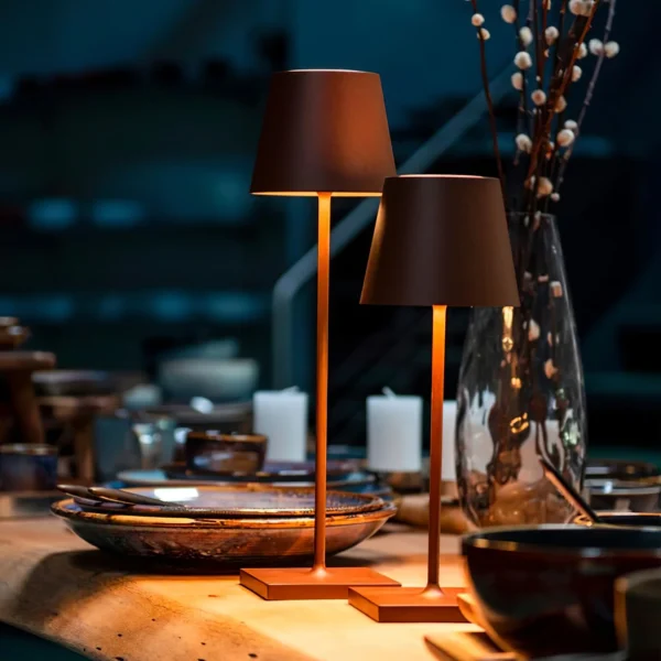 The fixture is made up of metal with LED light source, ensuring a clean display along with a tasteful layer of light. This piece lights the way wherever it is placed, providing a full and inviting glow. Its square base ensures a sturdy display. Purchase Notes: Only supports shipping to Japan, Australia, the EU, and the United States, other countries do not support shipping. If you have any questions about our products, please contact us and we will get back to you within 24 hours. Product Size Size: ∅ 4.3″ x H 15″ / Dia 11cm x H 38cm Details Material: Metal, Acrylic, Aluminum alloy Light source: Integrated LED Voltage: AC 110-240V Battery capacity (mAh): 2000 mAh Charging voltage: 5V---2A or 8V---2A Charging time: ~3 hours to fully charge Continuous discharge time: the maximum power can be used for about 3 hours, and the minimum power can be used continuously for about 10 hours. Color: White, Black, Gold, Pink, Silver Control method: Touch switch (Dimmable) We provide with USB charging cable. Approved: ETL, UL listed and CE, SAA certification.
