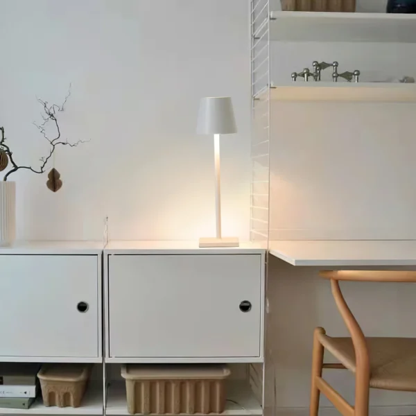 The fixture is made up of metal with LED light source, ensuring a clean display along with a tasteful layer of light. This piece lights the way wherever it is placed, providing a full and inviting glow. Its square base ensures a sturdy display. Purchase Notes: Only supports shipping to Japan, Australia, the EU, and the United States, other countries do not support shipping. If you have any questions about our products, please contact us and we will get back to you within 24 hours. Product Size Size: ∅ 4.3″ x H 15″ / Dia 11cm x H 38cm Details Material: Metal, Acrylic, Aluminum alloy Light source: Integrated LED Voltage: AC 110-240V Battery capacity (mAh): 2000 mAh Charging voltage: 5V---2A or 8V---2A Charging time: ~3 hours to fully charge Continuous discharge time: the maximum power can be used for about 3 hours, and the minimum power can be used continuously for about 10 hours. Color: White, Black, Gold, Pink, Silver Control method: Touch switch (Dimmable) We provide with USB charging cable. Approved: ETL, UL listed and CE, SAA certification.