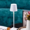 The fixture is made up of metal with LED light source, ensuring a clean display along with a tasteful layer of light. This piece lights the way wherever it is placed, providing a full and inviting glow. Its square base ensures a sturdy display. Purchase Notes: Only supports shipping to Japan, Australia, the EU, and the United States, other countries do not support shipping. If you have any questions about our products, please contact us and we will get back to you within 24 hours. Product Size Size: ∅ 4.3″ x H 15″ / Dia 11cm x H 38cm Details Material: Metal, Acrylic, Aluminum alloy Light source: Integrated LED Voltage: AC 110-240V Battery capacity (mAh): 2000 mAh Charging voltage: 5V---2A or 8V---2A Charging time: ~3 hours to fully charge Continuous discharge time: the maximum power can be used for about 3 hours, and the minimum power can be used continuously for about 10 hours. Color: White, Black, Gold, Pink, Silver Control method: Touch switch (Dimmable) We provide with USB charging cable. Approved: ETL, UL listed and CE, SAA certification.