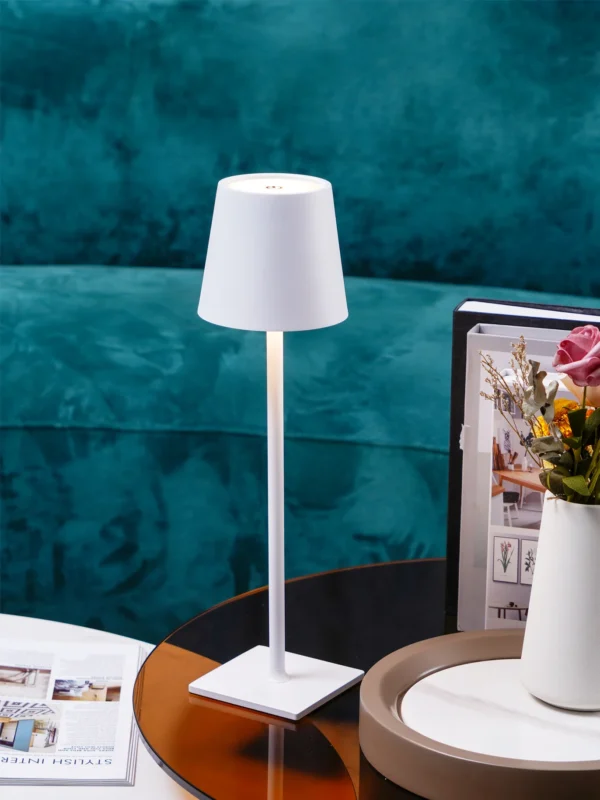 The fixture is made up of metal with LED light source, ensuring a clean display along with a tasteful layer of light. This piece lights the way wherever it is placed, providing a full and inviting glow. Its square base ensures a sturdy display. Purchase Notes: Only supports shipping to Japan, Australia, the EU, and the United States, other countries do not support shipping. If you have any questions about our products, please contact us and we will get back to you within 24 hours. Product Size Size: ∅ 4.3″ x H 15″ / Dia 11cm x H 38cm Details Material: Metal, Acrylic, Aluminum alloy Light source: Integrated LED Voltage: AC 110-240V Battery capacity (mAh): 2000 mAh Charging voltage: 5V---2A or 8V---2A Charging time: ~3 hours to fully charge Continuous discharge time: the maximum power can be used for about 3 hours, and the minimum power can be used continuously for about 10 hours. Color: White, Black, Gold, Pink, Silver Control method: Touch switch (Dimmable) We provide with USB charging cable. Approved: ETL, UL listed and CE, SAA certification.