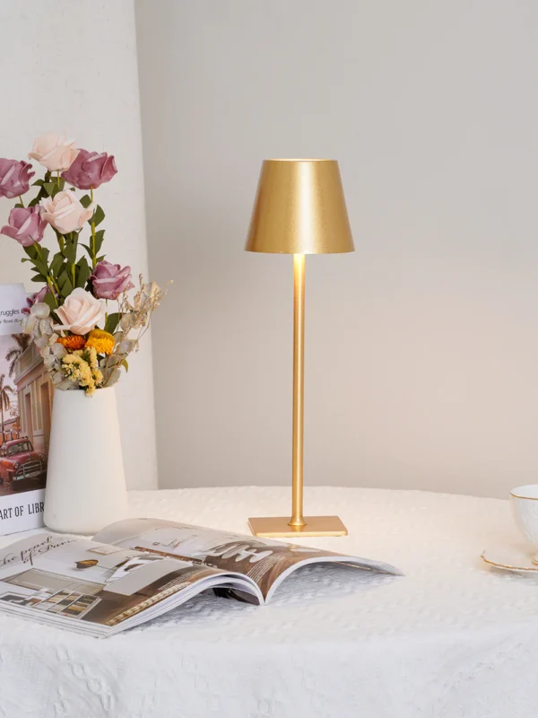 The fixture is made up of metal with LED light source, ensuring a clean display along with a tasteful layer of light. This piece lights the way wherever it is placed, providing a full and inviting glow. Its square base ensures a sturdy display. Purchase Notes: Only supports shipping to Japan, Australia, the EU, and the United States, other countries do not support shipping. If you have any questions about our products, please contact us and we will get back to you within 24 hours. Product Size Size: ∅ 4.3″ x H 15″ / Dia 11cm x H 38cm Details Material: Metal, Acrylic, Aluminum alloy Light source: Integrated LED Voltage: AC 110-240V Battery capacity (mAh): 2000 mAh Charging voltage: 5V---2A or 8V---2A Charging time: ~3 hours to fully charge Continuous discharge time: the maximum power can be used for about 3 hours, and the minimum power can be used continuously for about 10 hours. Color: White, Black, Gold, Pink, Silver Control method: Touch switch (Dimmable) We provide with USB charging cable. Approved: ETL, UL listed and CE, SAA certification.