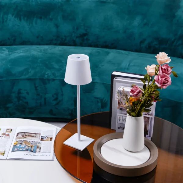 The fixture is made up of metal with LED light source, ensuring a clean display along with a tasteful layer of light. This piece lights the way wherever it is placed, providing a full and inviting glow. Its square base ensures a sturdy display. Purchase Notes: Only supports shipping to Japan, Australia, the EU, and the United States, other countries do not support shipping. If you have any questions about our products, please contact us and we will get back to you within 24 hours. Product Size Size: ∅ 4.3″ x H 15″ / Dia 11cm x H 38cm Details Material: Metal, Acrylic, Aluminum alloy Light source: Integrated LED Voltage: AC 110-240V Battery capacity (mAh): 2000 mAh Charging voltage: 5V---2A or 8V---2A Charging time: ~3 hours to fully charge Continuous discharge time: the maximum power can be used for about 3 hours, and the minimum power can be used continuously for about 10 hours. Color: White, Black, Gold, Pink, Silver Control method: Touch switch (Dimmable) We provide with USB charging cable. Approved: ETL, UL listed and CE, SAA certification.