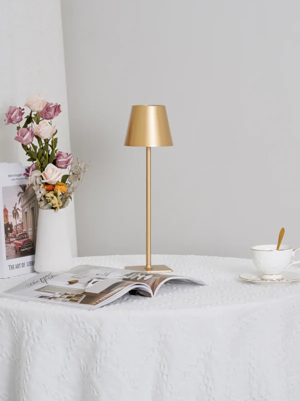 The fixture is made up of metal with LED light source, ensuring a clean display along with a tasteful layer of light. This piece lights the way wherever it is placed, providing a full and inviting glow. Its square base ensures a sturdy display. Purchase Notes: Only supports shipping to Japan, Australia, the EU, and the United States, other countries do not support shipping. If you have any questions about our products, please contact us and we will get back to you within 24 hours. Product Size Size: ∅ 4.3″ x H 15″ / Dia 11cm x H 38cm Details Material: Metal, Acrylic, Aluminum alloy Light source: Integrated LED Voltage: AC 110-240V Battery capacity (mAh): 2000 mAh Charging voltage: 5V---2A or 8V---2A Charging time: ~3 hours to fully charge Continuous discharge time: the maximum power can be used for about 3 hours, and the minimum power can be used continuously for about 10 hours. Color: White, Black, Gold, Pink, Silver Control method: Touch switch (Dimmable) We provide with USB charging cable. Approved: ETL, UL listed and CE, SAA certification.