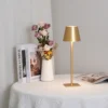 The fixture is made up of metal with LED light source, ensuring a clean display along with a tasteful layer of light. This piece lights the way wherever it is placed, providing a full and inviting glow. Its square base ensures a sturdy display. Purchase Notes: Only supports shipping to Japan, Australia, the EU, and the United States, other countries do not support shipping. If you have any questions about our products, please contact us and we will get back to you within 24 hours. Product Size Size: ∅ 4.3″ x H 15″ / Dia 11cm x H 38cm Details Material: Metal, Acrylic, Aluminum alloy Light source: Integrated LED Voltage: AC 110-240V Battery capacity (mAh): 2000 mAh Charging voltage: 5V---2A or 8V---2A Charging time: ~3 hours to fully charge Continuous discharge time: the maximum power can be used for about 3 hours, and the minimum power can be used continuously for about 10 hours. Color: White, Black, Gold, Pink, Silver Control method: Touch switch (Dimmable) We provide with USB charging cable. Approved: ETL, UL listed and CE, SAA certification.