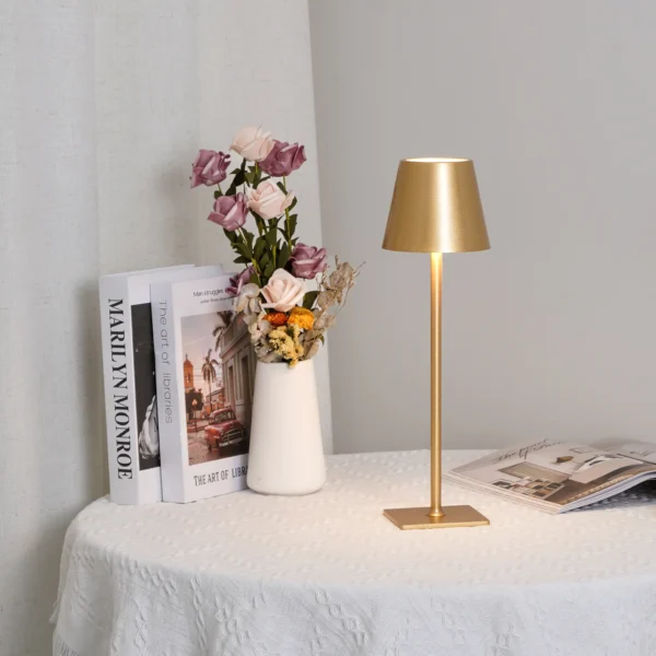 The fixture is made up of metal with LED light source, ensuring a clean display along with a tasteful layer of light. This piece lights the way wherever it is placed, providing a full and inviting glow. Its square base ensures a sturdy display. Purchase Notes: Only supports shipping to Japan, Australia, the EU, and the United States, other countries do not support shipping. If you have any questions about our products, please contact us and we will get back to you within 24 hours. Product Size Size: ∅ 4.3″ x H 15″ / Dia 11cm x H 38cm Details Material: Metal, Acrylic, Aluminum alloy Light source: Integrated LED Voltage: AC 110-240V Battery capacity (mAh): 2000 mAh Charging voltage: 5V---2A or 8V---2A Charging time: ~3 hours to fully charge Continuous discharge time: the maximum power can be used for about 3 hours, and the minimum power can be used continuously for about 10 hours. Color: White, Black, Gold, Pink, Silver Control method: Touch switch (Dimmable) We provide with USB charging cable. Approved: ETL, UL listed and CE, SAA certification.