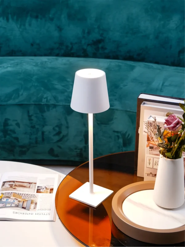 The fixture is made up of metal with LED light source, ensuring a clean display along with a tasteful layer of light. This piece lights the way wherever it is placed, providing a full and inviting glow. Its square base ensures a sturdy display. Purchase Notes: Only supports shipping to Japan, Australia, the EU, and the United States, other countries do not support shipping. If you have any questions about our products, please contact us and we will get back to you within 24 hours. Product Size Size: ∅ 4.3″ x H 15″ / Dia 11cm x H 38cm Details Material: Metal, Acrylic, Aluminum alloy Light source: Integrated LED Voltage: AC 110-240V Battery capacity (mAh): 2000 mAh Charging voltage: 5V---2A or 8V---2A Charging time: ~3 hours to fully charge Continuous discharge time: the maximum power can be used for about 3 hours, and the minimum power can be used continuously for about 10 hours. Color: White, Black, Gold, Pink, Silver Control method: Touch switch (Dimmable) We provide with USB charging cable. Approved: ETL, UL listed and CE, SAA certification.