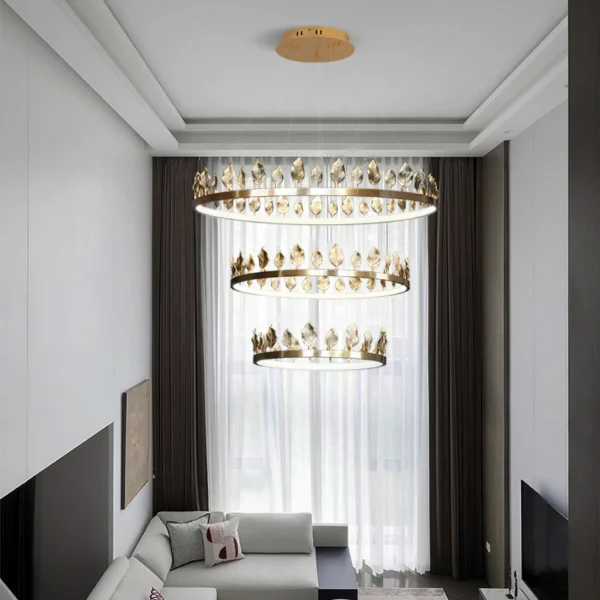 Our Anello Chandelier is shaped like a crown made of laurel leaves. The design is brilliant in a mix of contemporary gold leaf and painted gold finishes. Because the leaves are hand-applied, slight variations in shape may exist on this gold chandelier.