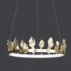 Our Anello Chandelier is shaped like a crown made of laurel leaves. The design is brilliant in a mix of contemporary gold leaf and painted gold finishes. Because the leaves are hand-applied, slight variations in shape may exist on this gold chandelier.