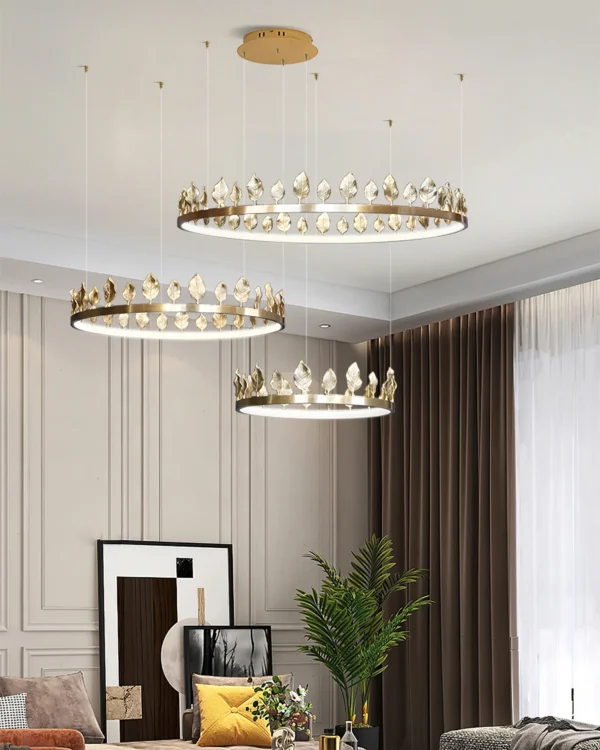 Our Anello Chandelier is shaped like a crown made of laurel leaves. The design is brilliant in a mix of contemporary gold leaf and painted gold finishes. Because the leaves are hand-applied, slight variations in shape may exist on this gold chandelier.