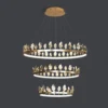 Our Anello Chandelier is shaped like a crown made of laurel leaves. The design is brilliant in a mix of contemporary gold leaf and painted gold finishes. Because the leaves are hand-applied, slight variations in shape may exist on this gold chandelier.