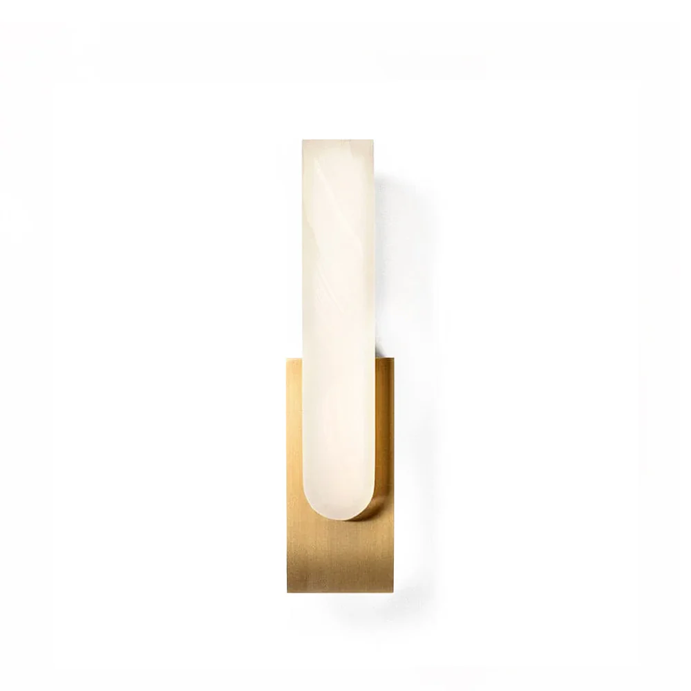 Fusing the purity of brass with the warmth of onyx, the Agatha Sconce revers the natural wonders of both. The inherent translucence of onyx comes alive once turned on, revealing veins and figuring deep in the shade that is unique to each individual one. These age-old materials are assembled around cutting-edge LED technology that ensures the right tones and even cast of light.