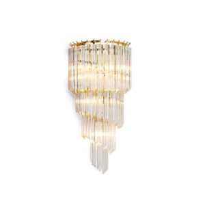 The Frost Amici Wall Lamp by Dekorfine combines the elegance of stainless steel with the brilliance of crystal. This sophisticated wall lamp features a stunning crystal lampshade that cascades light in a mesmerizing display. The luxurious design, with its shimmering crystal elements and sleek stainless steel structure, makes it a perfect addition to any modern or classic decor. Elevate your interior with the refined beauty and sparkling allure of the Frost Amici Wall Lamp. If you have any questions about our products, please contact us and we will get back to you within 24 hours. Product Size Size: Dia 30cm x H 62cm / ∅ 11.8″ x H 24.4″ Details Material: Stainless steel, Crystal Light source: LED bulb or Edison bulb Bulb base type: G9 Voltage: AC 110-240V Mounting: Wall Environment: Indoor Finishes: Opaque Crystal, Gold Control method: Compatible with common wall switch (not included). Switch: This switch should be connected to an external wall light switch, allowing for controlled electricity supply. Approved: ETL, UL listed and CE, SAA certification.